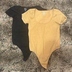 TWO BDG brand bodysuits.